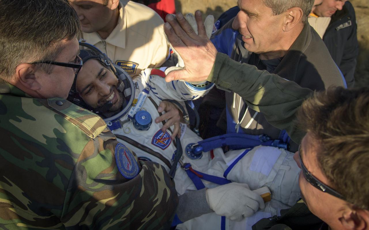 Visiting astronaut Hazzaa Ali Almansoori of the United Arab Emirates is helped out of the Soyuz MS-12 spacecraft just minutes after he and Expedition 60 crewmembers Alexey Ovchinin of Roscosmos and Nick Hague of NASA landed in a remote area near the town of Zhezkazgan, Kazakhstan on Thursday, Oct. 3, 2019. Hague and Ovchinin are returning after 203 days in space where they served as members of the Expedition 59 and 60 crews onboard the International Space Station. Almansoori logged 8 days in space during his first flight as an astronaut. Photo Credit: (NASA/Bill Ingalls)