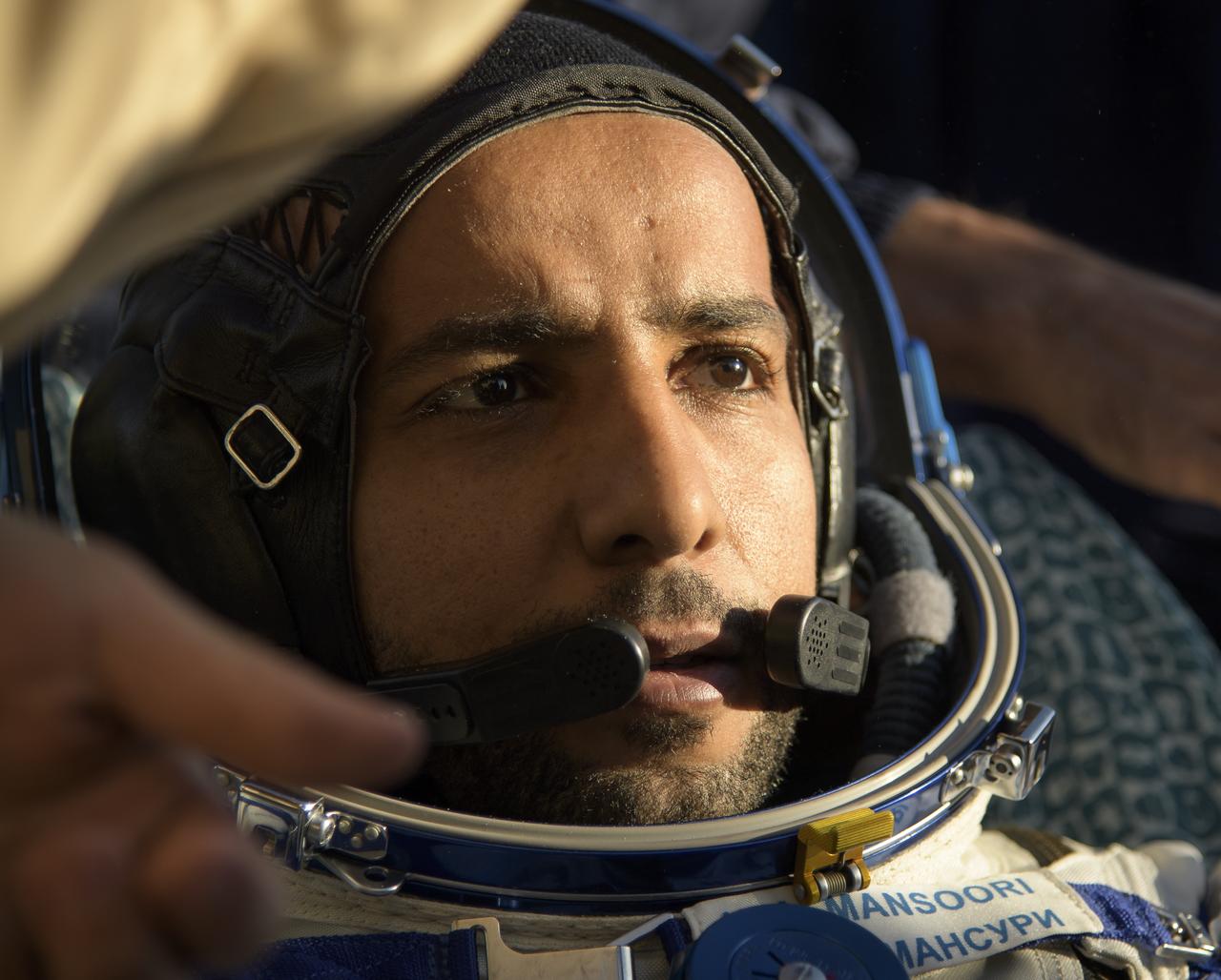 Visiting astronaut Hazzaa Ali Almansoori of the United Arab Emirates is seen outside the Soyuz MS-12 spacecraft after he landed with Expedition 60 crewmembers Nick Hague of NASA and Alexey Ovchinin of Roscosmos in a remote area near the town of Zhezkazgan, Kazakhstan on Thursday, Oct. 3, 2019. Hague and Ovchinin are returning after 203 days in space where they served as members of the Expedition 59 and 60 crews onboard the International Space Station. Almansoori logged 8 days in space during his first flight as an astronaut. Photo Credit: (NASA/Bill Ingalls)