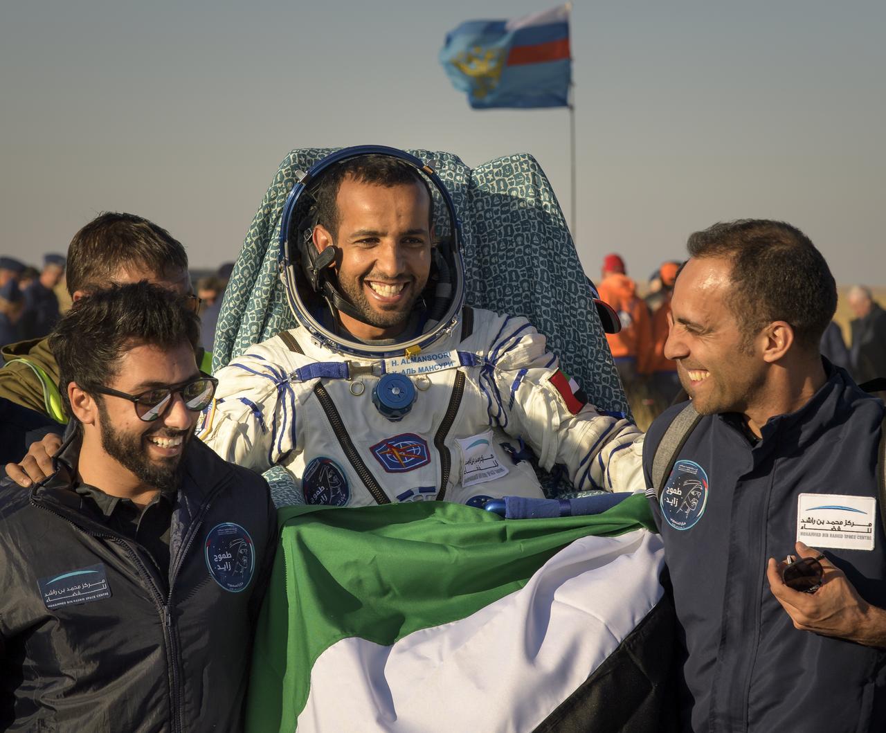 Visiting astronaut Hazzaa Ali Almansoori of the United Arab Emiratesis carried to a medical tent shortly after he and Expedition 60 crewmembers Alexey Ovchinin of Roscosmos and Nick Hague of NASA landed in their Soyuz MS-12 spacecraft near the town of Zhezkazgan, Kazakhstan on Thursday, Oct. 3, 2019. Hague and Ovchinin are returning after 203 days in space where they served as members of the Expedition 59 and 60 crews onboard the International Space Station. Almansoori logged 8 days in space during his first flight as an astronaut. Photo Credit: (NASA/Bill Ingalls)