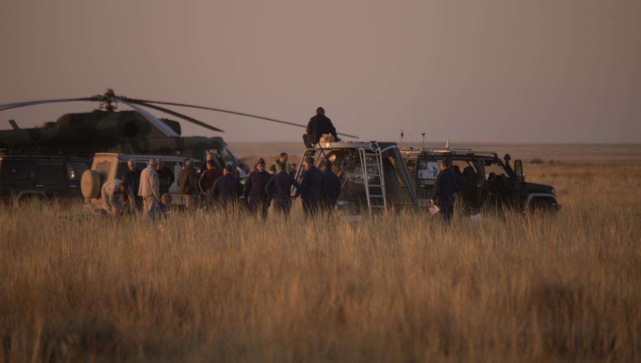 Russian support personnel work around the Soyuz MS-12 spacecraft after it landed with Expedition 60 crew members Nick Hague of NASA and Alexey Ovchinin of Roscosmos, along with visiting astronaut Hazzaa Ali Almansoori of the United Arab Emirates, Thursday, Oct. 3, 2019. Hague and Ovchinin are returning after 203 days in space where they served as members of the Expedition 59 and 60 crews onboard the International Space Station. Almansoori logged 8 days in space during his first flight as an astronaut. Photo Credit: (NASA/Bill Ingalls)