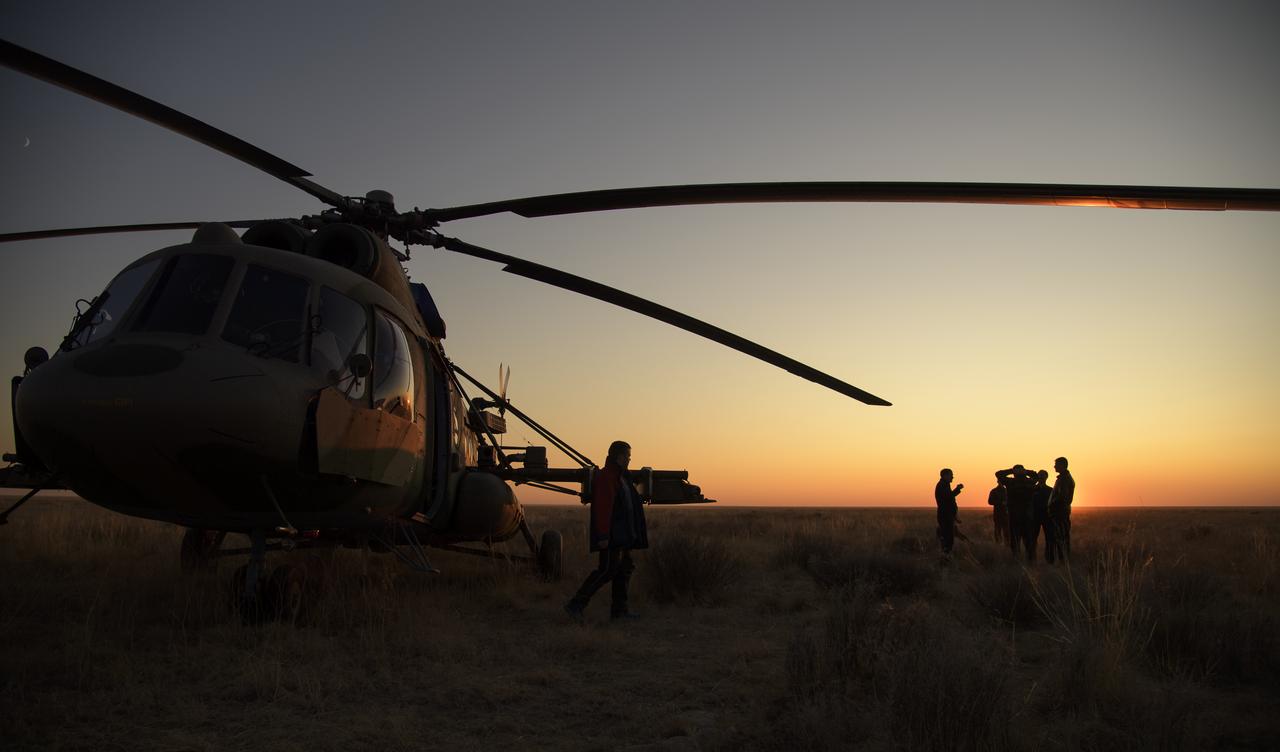 Supports teams wait to depart the Soyuz MS-12 spacecraft landing site after the capsule landed with Expedition 60 crew members Nick Hague of NASA and Alexey Ovchinin of Roscosmos, along with visiting astronaut Hazzaa Ali Almansoori of the United Arab Emirates in a remote area near the town of Zhezkazgan, Kazakhstan, Thursday, Oct. 3, 2019. Hague and Ovchinin are returning after 203 days in space where they served as members of the Expedition 59 and 60 crews onboard the International Space Station. Almansoori logged 8 days in space during his first flight as an astronaut. Photo Credit: (NASA/Bill Ingalls)