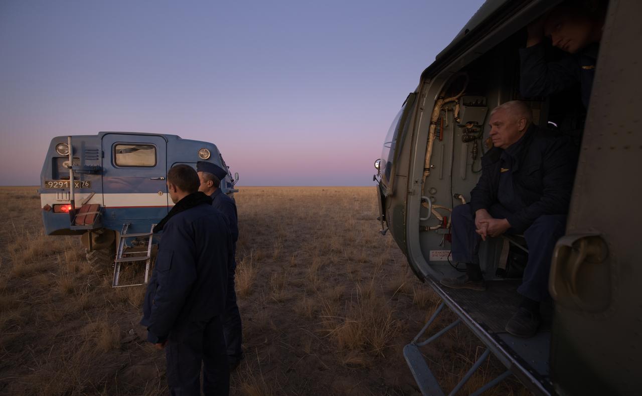 An all-terrain vehicle, with Expedition 60 crewmember Nick Hague of NASA onboard, is backed up to an awaiting helicopter after Hague landed in the Soyuz MS-12 spacecraft with Expedition 60 crewmember Alexey Ovchinin of Roscosmos, and visiting astronaut Hazzaa Ali Almansoori of the United Arab Emirates in a remote area near the town of Zhezkazgan, Kazakhstan, Thursday, Oct. 3, 2019. Hague and Ovchinin are returning after 203 days in space where they served as members of the Expedition 59 and 60 crews onboard the International Space Station. Almansoori logged 8 days in space during his first flight as an astronaut. Photo Credit: (NASA/Bill Ingalls)