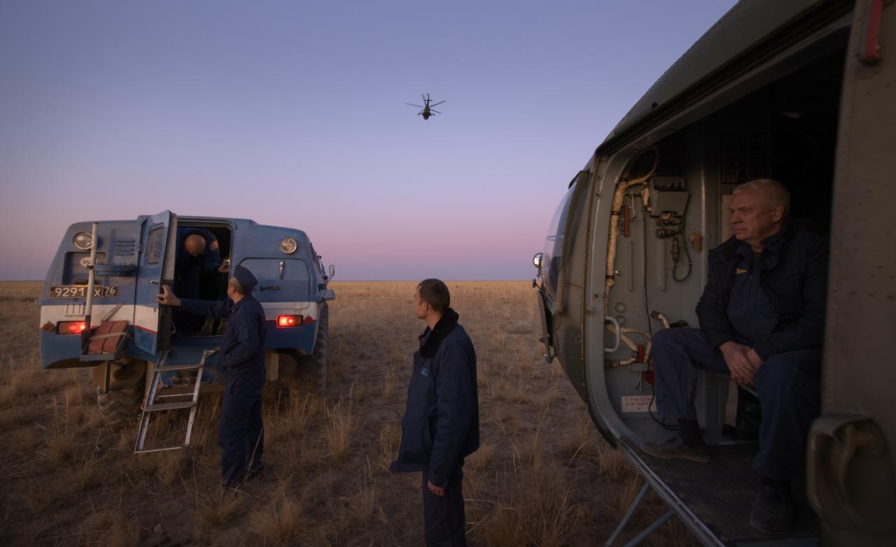 An all-terrain vehicle, with Expedition 60 crewmember Nick Hague of NASA onboard, arrives to an awaiting helicopter after Hague landed in the Soyuz MS-12 spacecraft with Expedition 60 crewmember Alexey Ovchinin of Roscosmos, and visiting astronaut Hazzaa Ali Almansoori of the United Arab Emirates in a remote area near the town of Zhezkazgan, Kazakhstan, Thursday, Oct. 3, 2019. Hague and Ovchinin are returning after 203 days in space where they served as members of the Expedition 59 and 60 crews onboard the International Space Station. Almansoori logged 8 days in space during his first flight as an astronaut. Photo Credit: (NASA/Bill Ingalls)