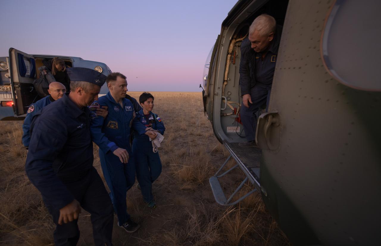 Expedition 60 crewmember Nick Hague of NASA is chelped into a Russian MI-8 helicopter after he and fellow Expedition 60 crewmember Alexey Ovchinin of Roscosmos and visiting astronaut Hazzaa Ali Almansoori of the United Arab Emirates landed in their Soyuz MS-12 spacecraft near the town of Zhezkazgan, Kazakhstan on Thursday, Oct. 3, 2019. Hague and Ovchinin are returning after 203 days in space where they served as members of the Expedition 59 and 60 crews onboard the International Space Station. Almansoori logged 8 days in space during his first flight as an astronaut. Photo Credit: (NASA/Bill Ingalls)