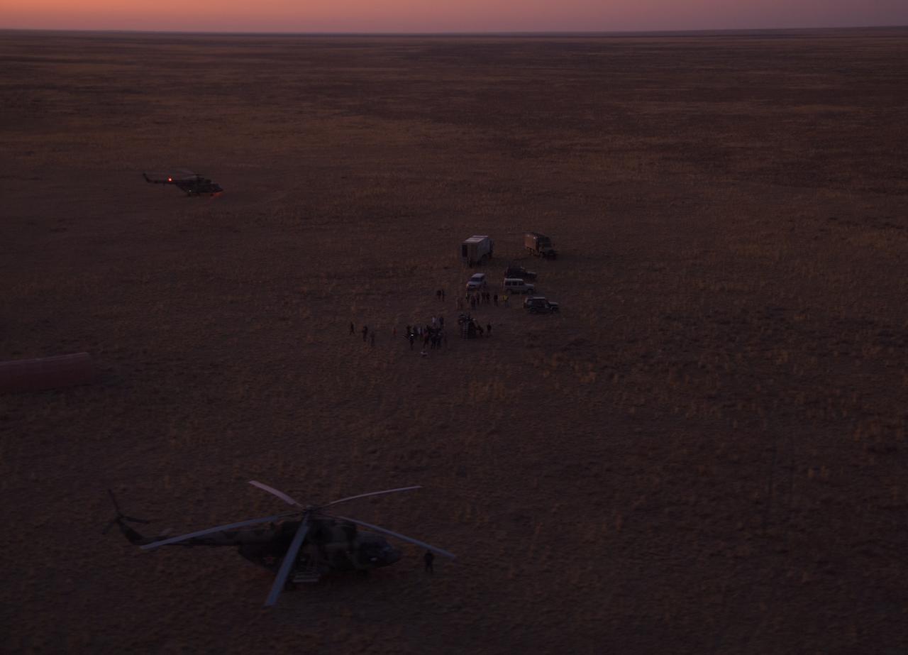 The Soyuz MS-12 spacecraft landing site is seen from the helicopter carrying Expedition 60 crew member Nick Hague of NASA back to Karaganda, Kazakhstan, Thursday, Oct. 3, 2019. Hague and fellow Expedition 60 crewmember Alexey Ovchinin are returning after 203 days in space where they served as members of the Expedition 59 and 60 crews onboard the International Space Station. Visiting astronaut Hazzaa Ali Almansoori of the United Arab Emirates also returned with etc crew after logging 8 days in space during his first flight as an astronaut. Photo Credit: (NASA/Bill Ingalls)