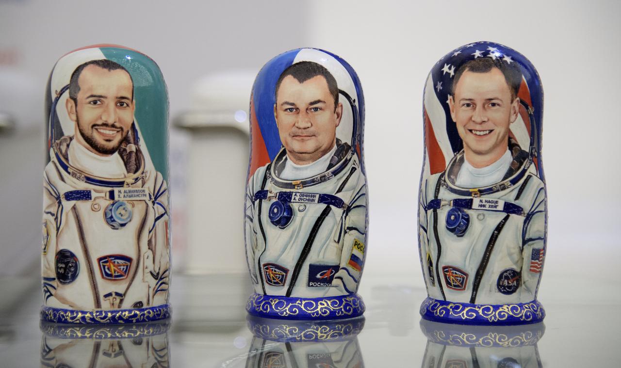 Matryoshka Dolls depicting visiting astronaut Hazzaa Ali Almansoori of the United Arab Emirates, left, Expedition 60 Roscosmos cosmonaut Alexey Ovchinin, center, and Expedition 60 astronaut Nick Hague of NASA are seen at a Karaganda Airport welcome ceremony in Kazakhstan on Thursday, Oct. 3, 2019. Hague and Ovchinin are returning after 203 days in space where they served as members of the Expedition 59 and 60 crews onboard the International Space Station. Almansoori logged 8 days in space during his first flight as an astronaut. Photo Credit: (NASA/Bill Ingalls)