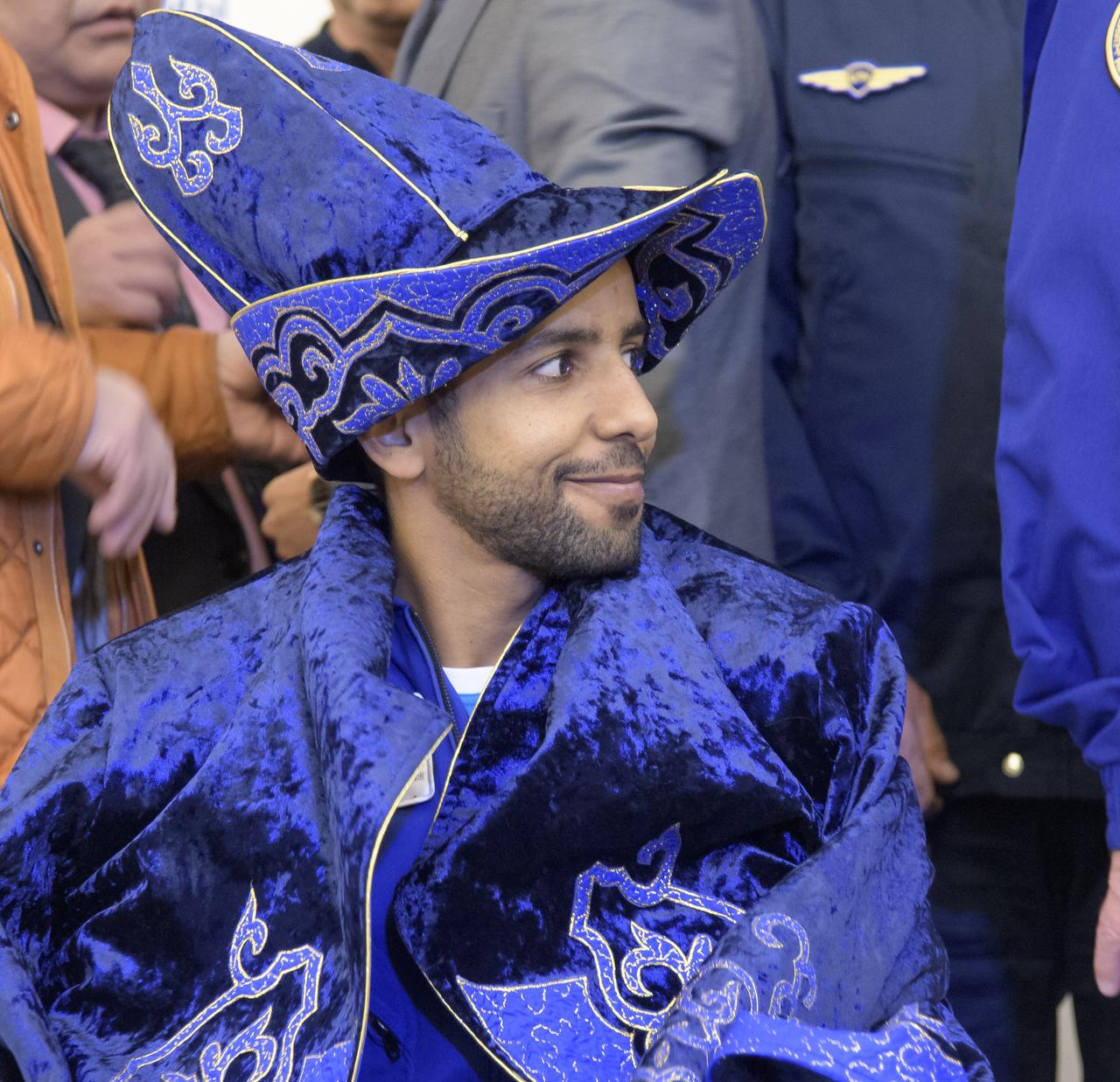Visiting astronaut Hazzaa Ali Almansoori of the United Arab Emirates attends a Karaganda Airport welcome ceremony in Kazakhstan on Thursday, Oct. 3, 2019. Expedition 60 crewmembers Alexey Ovchinin of Roscosmos and Nick Hague of NASA are returning after 203 days in space where they served as members of the Expedition 59 and 60 crews onboard the International Space Station. Almansoori logged 8 days in space during his first flight as an astronaut. Photo Credit: (NASA/Bill Ingalls)