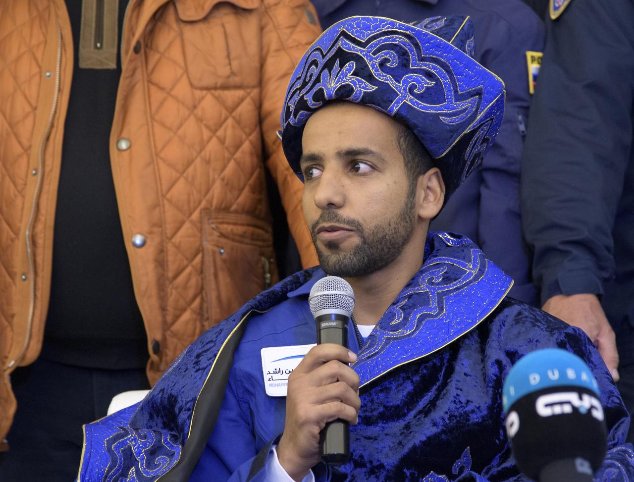 Visiting astronaut Hazzaa Ali Almansoori of the United Arab Emirates attends a Karaganda Airport welcome ceremony in Kazakhstan on Thursday, Oct. 3, 2019. Expedition 60 crewmembers Alexey Ovchinin of Roscosmos and Nick Hague of NASA are returning after 203 days in space where they served as members of the Expedition 59 and 60 crews onboard the International Space Station. Almansoori logged 8 days in space during his first flight as an astronaut. Photo Credit: (NASA/Bill Ingalls)