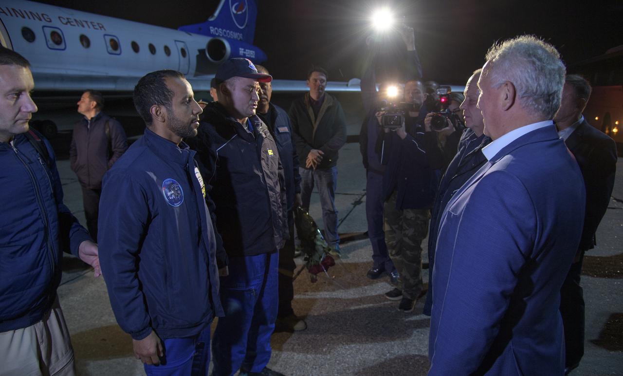 Officials, family and friends welcome home visiting astronaut Hazzaa Ali Almansoori of the United Arab Emirates, left, and Expedition 60 cosmonaut Alexey Ovchinin of Roscosmos, Friday, Oct. 4, 2019 in Star City, Russia. Ovchinin returned after 203 days in space with NASA astronaut Nick Hague where they served as members of the Expedition 59 and 60 crews onboard the International Space Station. Almansoori logged 8 days in space during his first flight as an astronaut. Photo Credit: (NASA/Bill Ingalls)