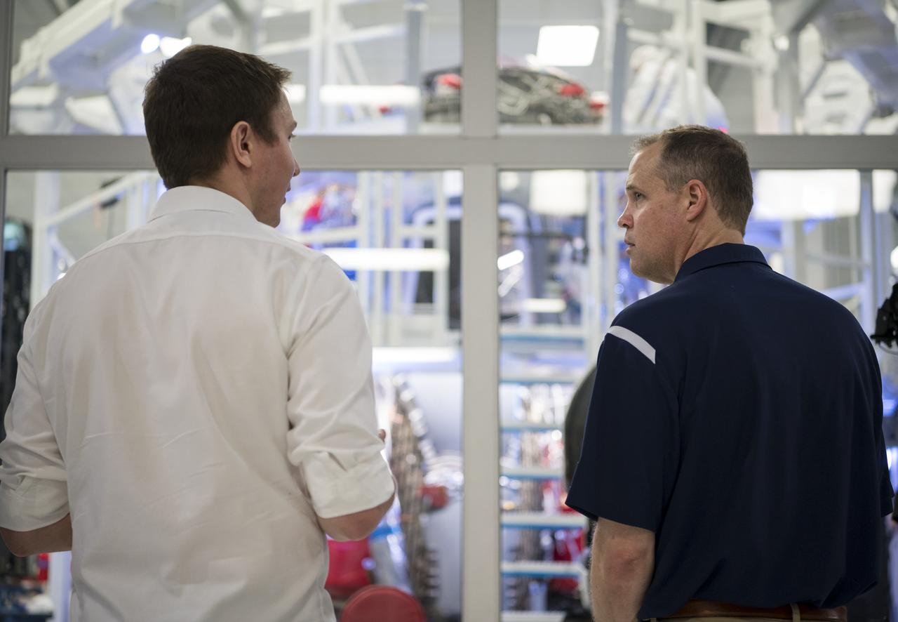 NASA Administrator Jim Bridenstine, right, speaks to Joseph Petrzelka of SpaceX about the Dragon capsule that will launch during the Demo-2 mission while on a tour of the SpaceX Headquarters, Thursday, Oct. 10, 2019 in Hawthorne, CA. Photo credit: (NASA/Aubrey Gemignani)