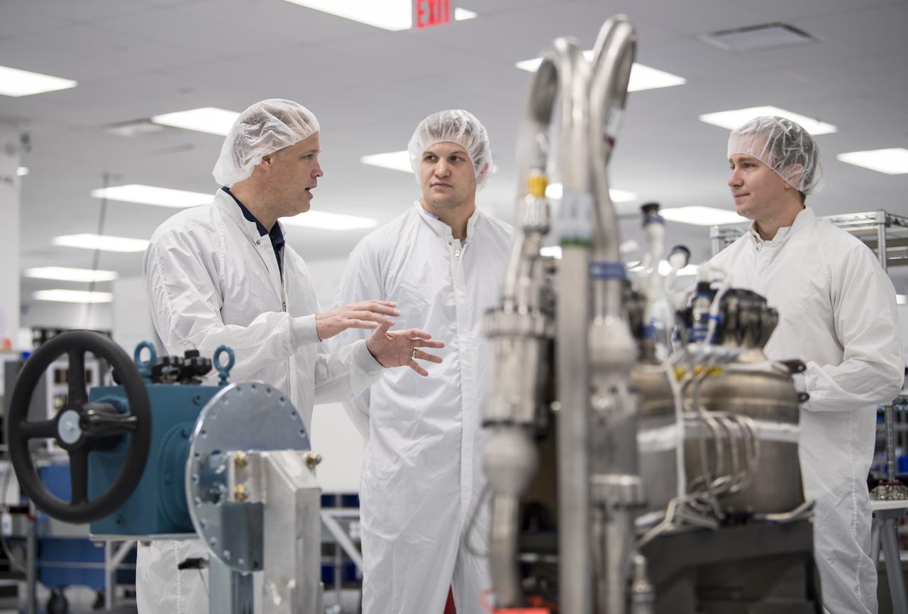 NASA Administrator Jim Bridenstine, left, speaks with SpaceX employees working on Super Draco engines during a tour of the SpaceX Headquarters, Thursday, Oct. 10, 2019 in Hawthorne, CA. Photo credit: (NASA/Aubrey Gemignani)