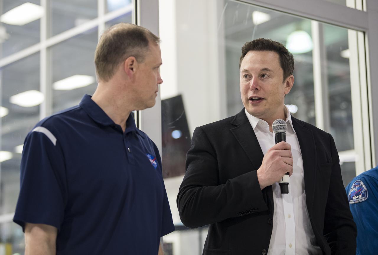 SpaceX Chief Engineer Elon Musk, right, speaks to press with NASA Administrator Jim Bridenstine, in front of the Crew Dragon that is being prepared for the Demo-2 mission, at SpaceX Headquarters, Thursday, Oct. 10, 2019 in Hawthorne, CA. Photo credit: (NASA/Aubrey Gemignani)