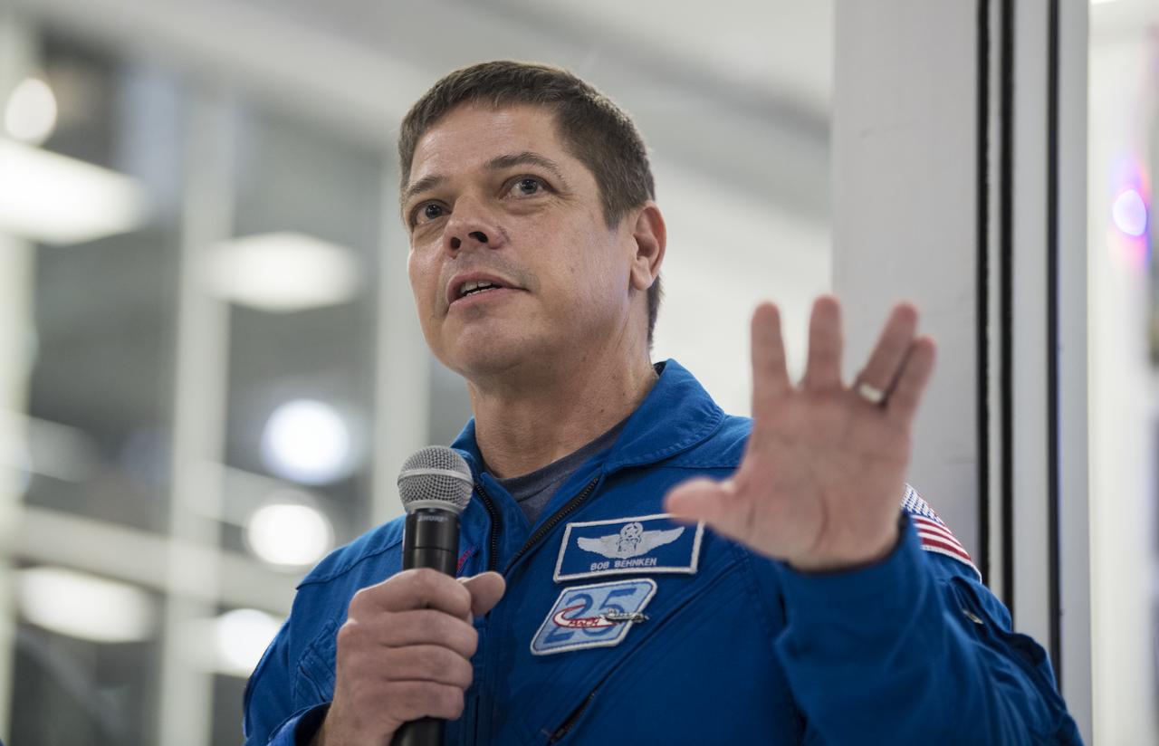 NASA astronaut Bob Behnken answers a question from the media in front of the Crew Dragon that is being prepared for the Demo-2 mission, at SpaceX Headquarters, Thursday, Oct. 10, 2019 in Hawthorne, CA. Behnken and NASA astronaut Doug Hurley are assigned to fly onboard Crew Dragon for the Demo-2 mission.Photo credit: (NASA/Aubrey Gemignani)