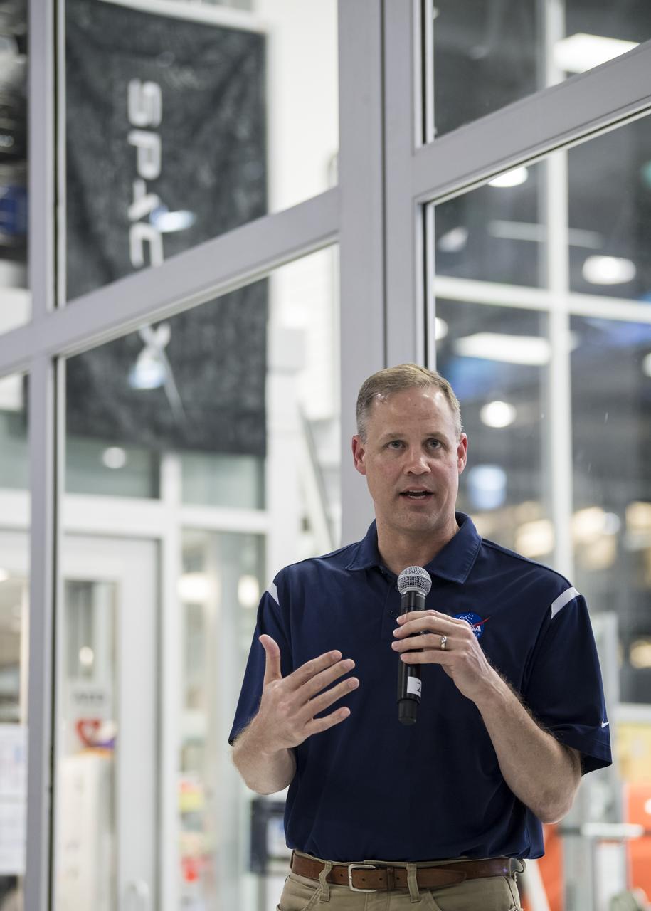 NASA Administrator Jim Bridenstine answers a question from the press in front of the Crew Dragon that is being prepared for the Demo-2 mission, at SpaceX Headquarters, Thursday, Oct. 10, 2019 in Hawthorne, CA. Photo credit: (NASA/Aubrey Gemignani)