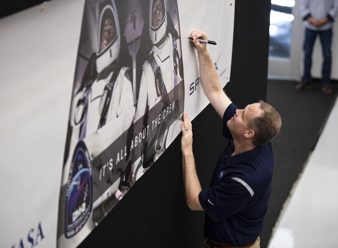 NASA Administrator Jim Bridenstine, signs a banner during a tour of the SpaceX Headquarters, Thursday, Oct. 10, 2019 in Hawthorne, CA. Photo credit: (NASA/Aubrey Gemignani)