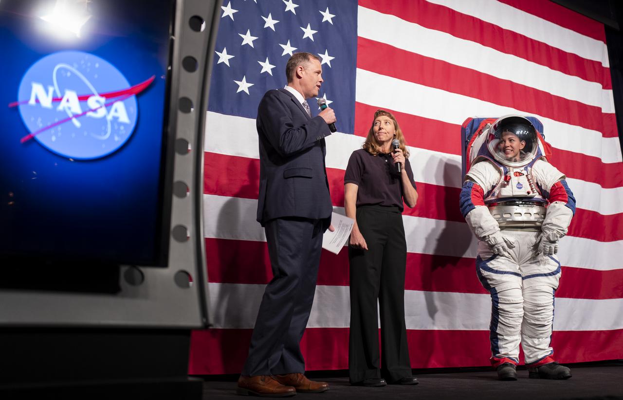 NASA Administrator Jim Bridenstine, left, and Amy Ross, a spacesuit engineer at NASA’s Johnson Space Center, left, are seen with Kristine Davis, a spacesuit engineer at NASA’s Johnson Space Center, wearing a ground prototype of NASA’s new Exploration Extravehicular Mobility Unit (xEMU), during a demonstration of the suit, Tuesday, Oct. 15, 2019 at NASA Headquarters in Washington. The xEMU suit improves on the suits previous worn on the Moon during the Apollo era and those currently in use for spacewalks outside the International Space Station and will be will be worn by first woman and next man as they explore the Moon as part of the agency’s Artemis program.  Photo Credit: (NASA/Joel Kowsky)