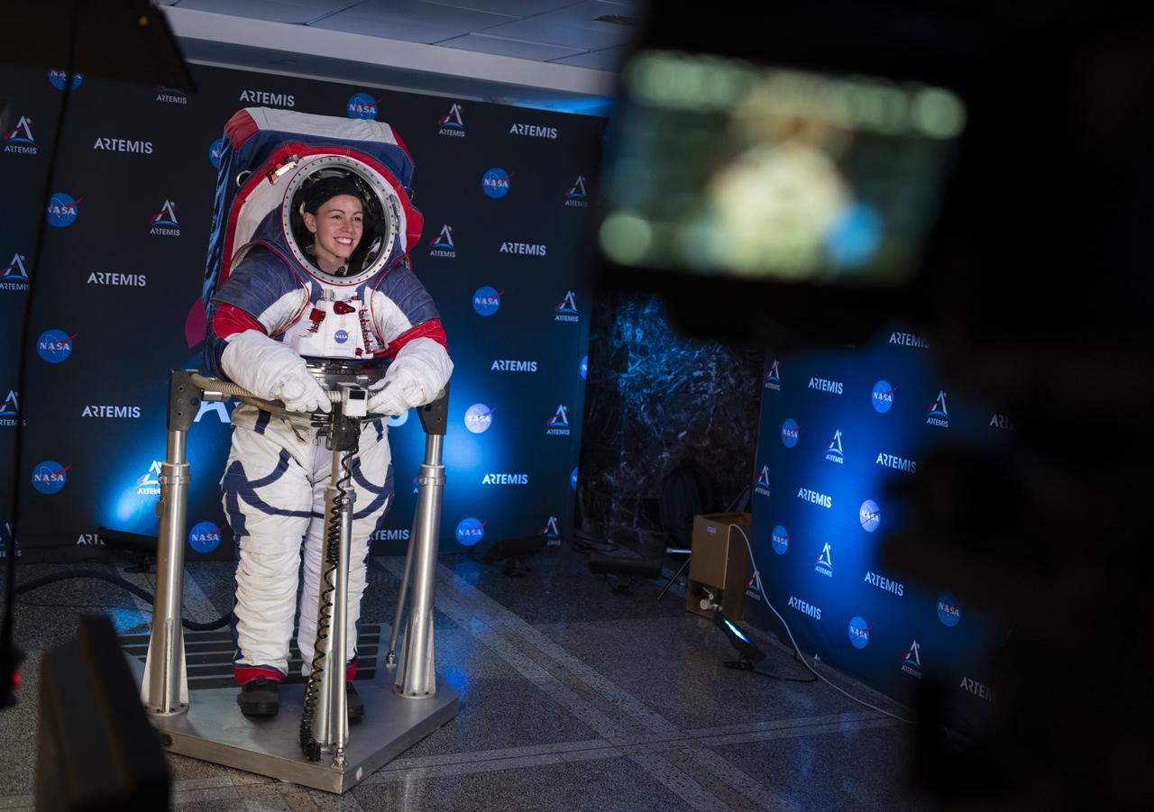 Kristine Davis, a spacesuit engineer at NASA’s Johnson Space Center, wearing a ground prototype of NASA’s new Exploration Extravehicular Mobility Unit (xEMU), is seen during a demonstration of the suit, Tuesday, Oct. 15, 2019 at NASA Headquarters in Washington. The xEMU suit improves on the suits previous worn on the Moon during the Apollo era and those currently in use for spacewalks outside the International Space Station and will be worn by first woman and next man as they explore the Moon as part of the agency’s Artemis program.  Photo Credit: (NASA/Joel Kowsky)