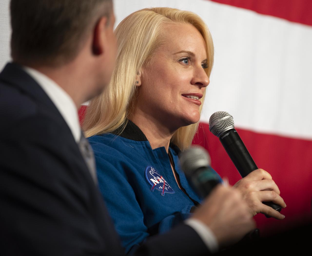 NASA astronaut Kate Rubins answers an audience question during a panel discussion with NASA Administrator Jim Bridenstine and Chris Hansen, Manager of the Extravehicular Activity office at NASA’s Johnson Space Center during the Artemis Generation Spacesuit event, Tuesday, Oct. 15, 2019 at NASA Headquarters in Washington. The Exploration Extravehicular Mobility Unit (xEMU) suit improves on the suits previous worn on the Moon during the Apollo era and those currently in use for spacewalks outside the International Space Station and will be worn by first woman and next man as they explore the Moon as part of the agency’s Artemis program. The Orion Crew Survival System (OCSS) suit is designed for a custom fit and incorporates safety technology and mobility features that will help protect astronauts on launch day, in emergency situations, high-risk parts of missions near the Moon, and during the high-speed return to Earth.  Photo Credit: (NASA/Joel Kowsky)