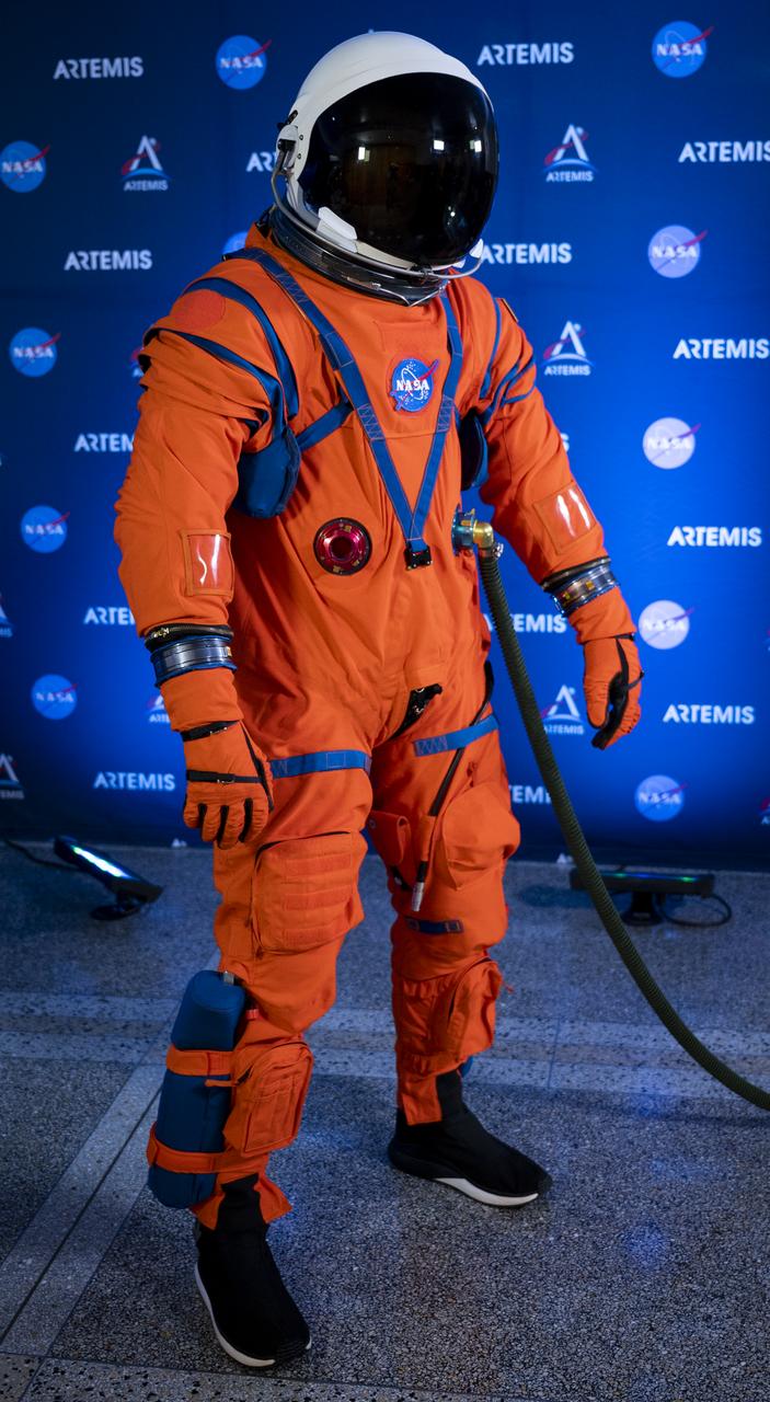 Dustin Gohmert, Orion Crew Survival Systems Project Manager at NASA’s Johnson Space Center, poses for a portrait while wearing the Orion Crew Survival System (OCSS) suit, Tuesday, Oct. 15, 2019 at NASA Headquarters in Washington, DC. The Orion suit is designed for a custom fit and incorporates safety technology and mobility features that will help protect astronauts on launch day, in emergency situations, high-risk parts of missions near the Moon, and during the high-speed return to Earth. Photo Credit: (NASA/Joel Kowsky)
