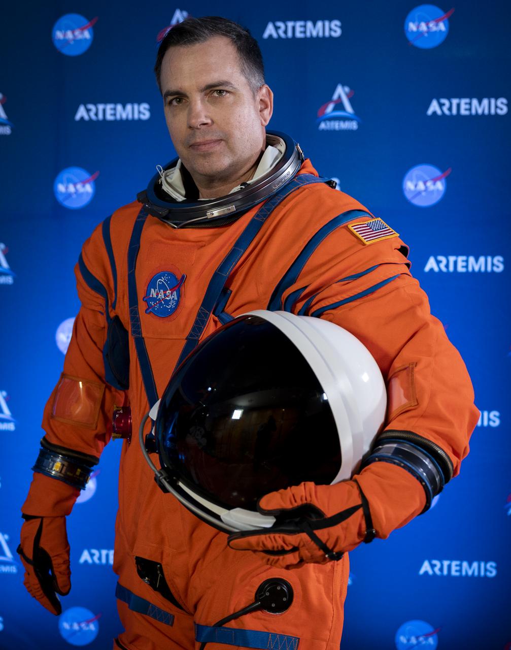 Dustin Gohmert, Orion Crew Survival Systems Project Manager at NASA’s Johnson Space Center, poses for a portrait while wearing the Orion Crew Survival System (OCSS) suit, Tuesday, Oct. 15, 2019 at NASA Headquarters in Washington, DC. The Orion suit is designed for a custom fit and incorporates safety technology and mobility features that will help protect astronauts on launch day, in emergency situations, high-risk parts of missions near the Moon, and during the high-speed return to Earth.   Photo Credit: (NASA/Joel Kowsky)