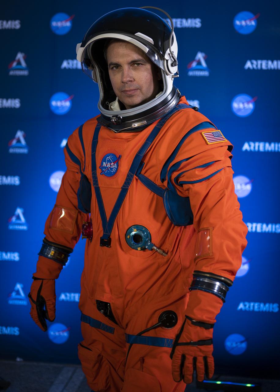 Dustin Gohmert, Orion Crew Survival Systems Project Manager at NASA’s Johnson Space Center, poses for a portrait while wearing the Orion Crew Survival System (OCSS) suit, Tuesday, Oct. 15, 2019 at NASA Headquarters in Washington, DC. The Orion suit is designed for a custom fit and incorporates safety technology and mobility features that will help protect astronauts on launch day, in emergency situations, high-risk parts of missions near the Moon, and during the high-speed return to Earth.   Photo Credit: (NASA/Joel Kowsky)