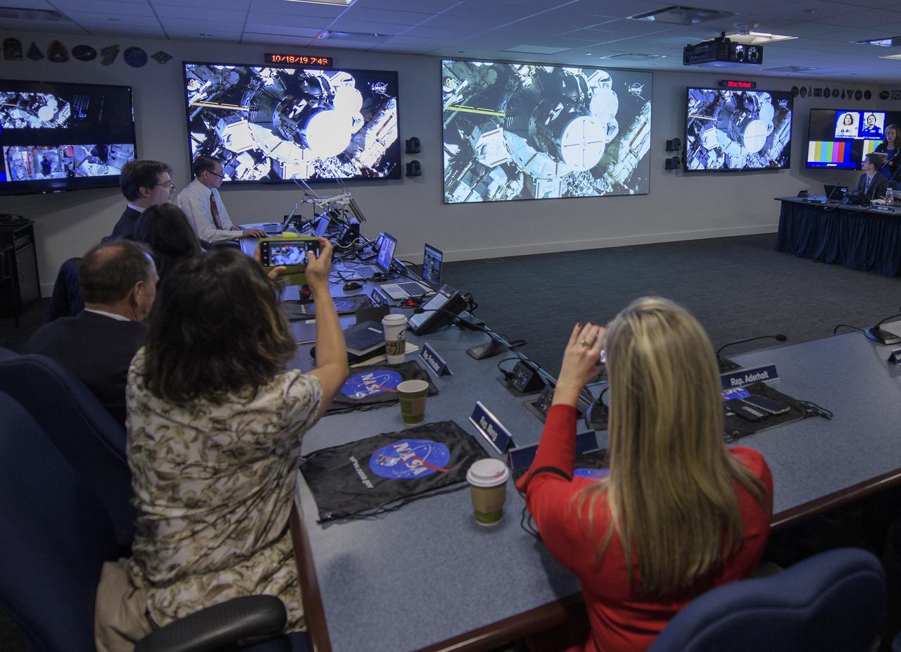 Rep. Kendra Horn, D-Okla., right, and Rep. Grace Meng, D-N.Y., are seen as they watch the beginning of the first all-woman spacewalk on Friday, Oct. 18, 2019, from the Space Operations Center at NASA Headquarters in Washington. The first all-woman spacewalk in history began at 7:38am EDT with NASA astronauts Christina Koch and Jessica Meir venturing outside the International Space Station to replace a failed battery charge-discharge unit. This is the fourth spacewalk for Koch and Meir’s first. Photo Credit: (NASA/Joel Kowsky)