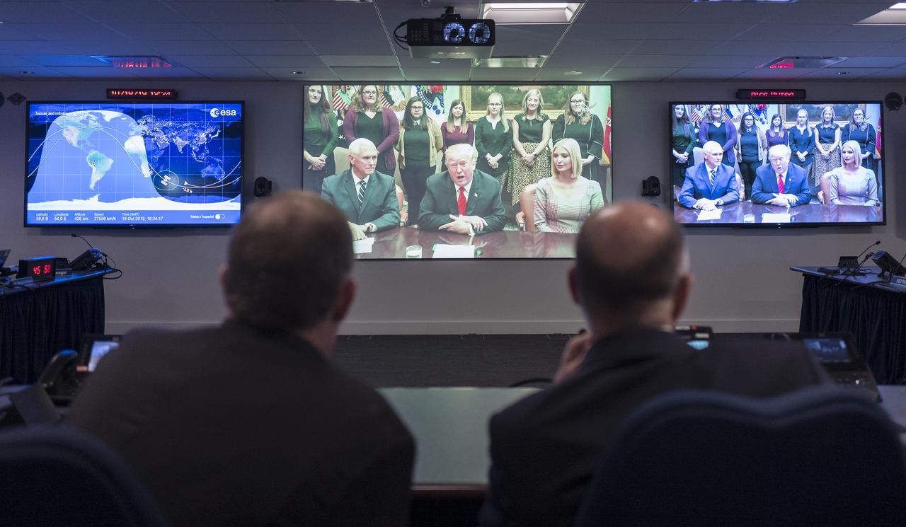NASA Deputy Administrator Jim Morhard and Sam Scimemi, Director of NASA’s International Space Station Division, watch from the Space Operations Center at NASA Headquarters as President Donald Trump, joined by Vice President Mike Pence, Advisor to the President Ivanka Trump and NASA Administrator Jim Bridenstine, talks to NASA astronauts Christina Koch and Jessica Meir from the Roosevelt Room of the White House as they conduct the first all-woman spacewalk on Friday, Oct. 18, 2019, in Washington. The first all-woman spacewalk in history began at 7:38am EDT with NASA astronauts Christina Koch and Jessica Meir venturing outside the International Space Station to replace a failed battery charge-discharge unit. This is the fourth spacewalk for Koch and Meir’s first. Photo Credit: (NASA/Joel Kowsky)
