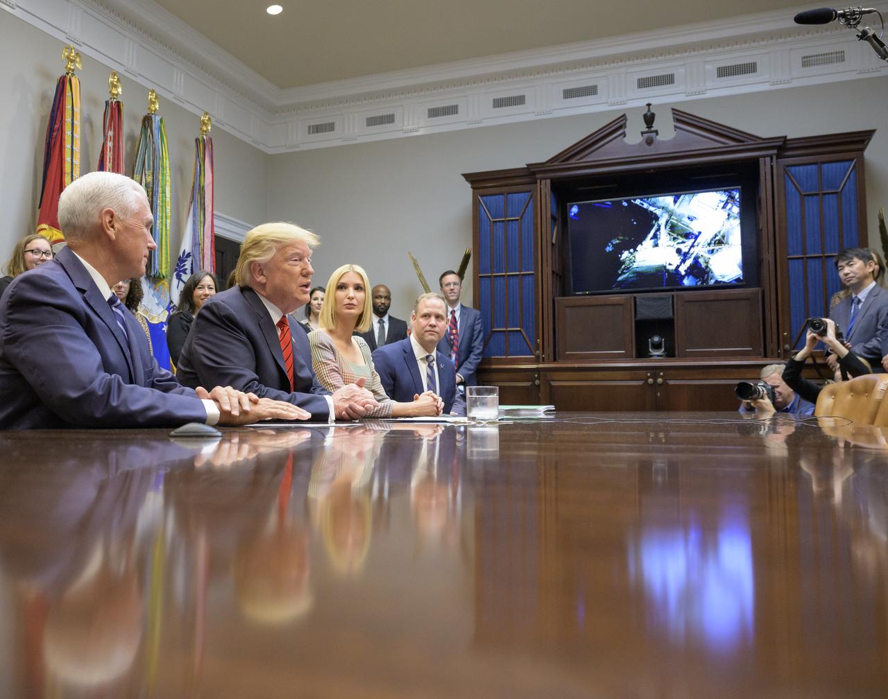 President Donald Trump, 2nd from left, joined by Vice President Mike Pence, left, Advisor to the President Ivanka Trump, and NASA Administrator Jim Bridenstine, right, speaks with NASA astronauts Christina Koch and Jessica Meir during the first all-woman spacewalk on Friday, Oct. 18, 2019, from the Roosevelt Room of the White House in Washington. The first all-woman spacewalk in history began at 7:38am EDT with Koch and Meir venturing outside the International Space Station to replace a failed battery charge-discharge unit. This is the fourth spacewalk for Koch and Meir’s first. Photo Credit: (NASA/Bill Ingalls)
