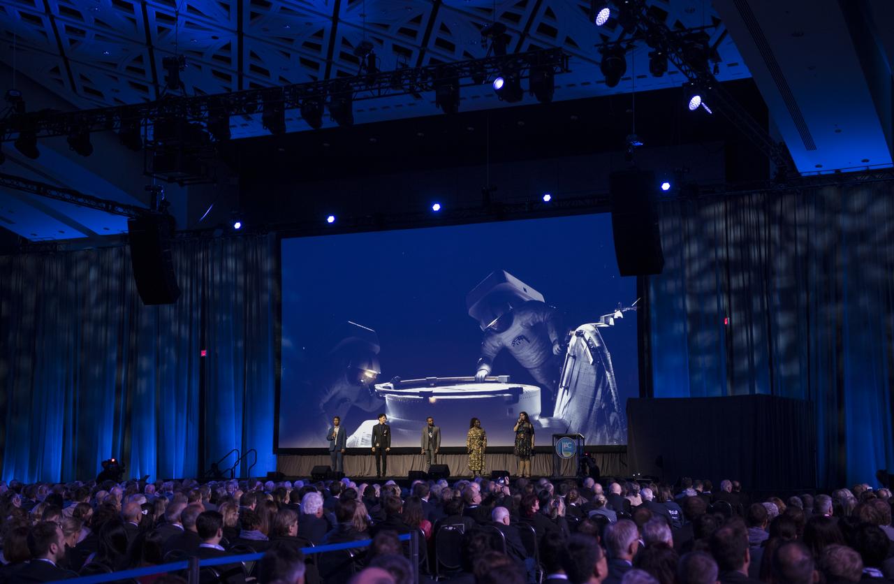 Broadway performs are seen as they sing during the opening ceremony of the 70th International Astronautical Congress, Monday, Oct. 21, 2019 at the Walter E. Washington Convention Center in Washington. Photo Credit: (NASA/Joel Kowsky)
