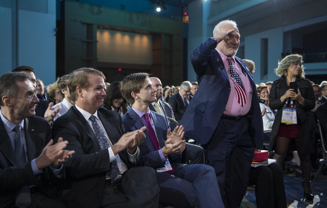 Buzz Aldrin, Apollo 11 lunar module pilot, salutes as he is recognized by Vice President Mike Pence during the opening ceremony of the 70th International Astronautical Congress, Monday, Oct. 21, 2019 at the Walter E. Washington Convention Center in Washington. Photo Credit: (NASA/Bill Ingalls)