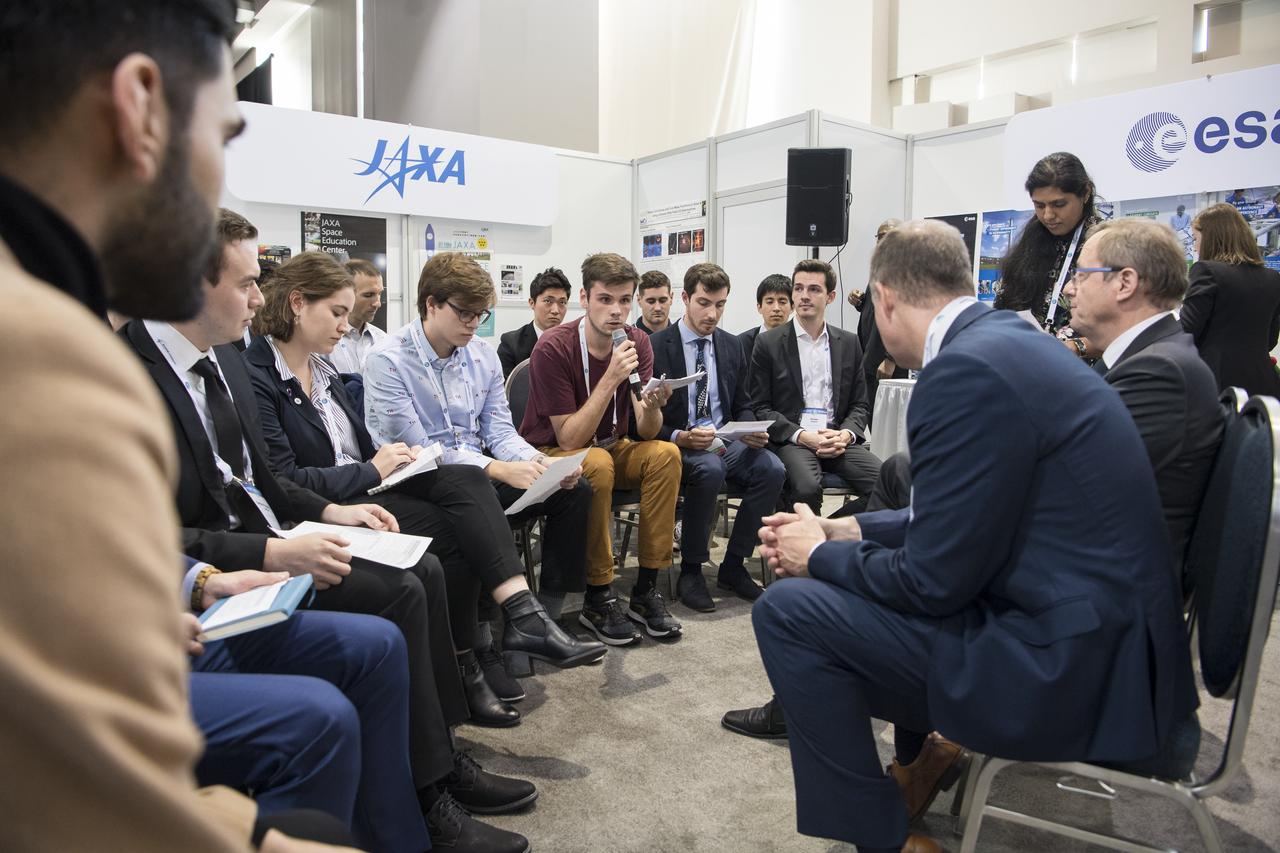 A student asks NASA Administrator Jim Bridenstine a question during a Heads of Agency interactive session with students at the 70th International Astronautical Congress, Monday, Oct. 21, 2019 at the Walter E. Washington Convention Center in Washington. Photo credit: (NASA/Aubrey Gemignani)