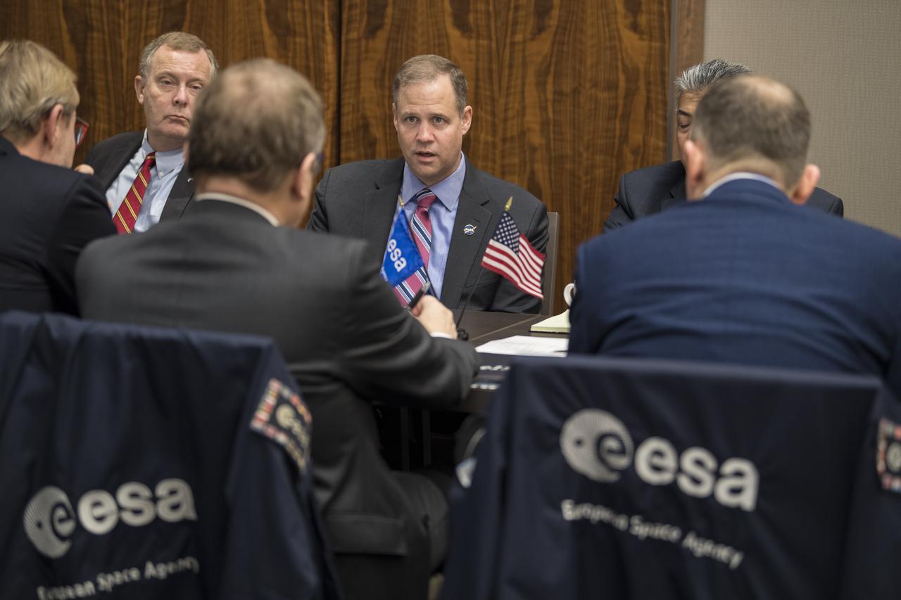 NASA Administrator Jim Bridenstine, center, and Deputy Administrator Jim Morhard, left, speak with Professor Johann-Dietrich Worner, Director General of ESA (European Space Agency), during the 70th International Astronautical Congress, Tuesday, Oct. 22, 2019 in Washington. Photo Credit: (NASA/Aubrey Gemignani)