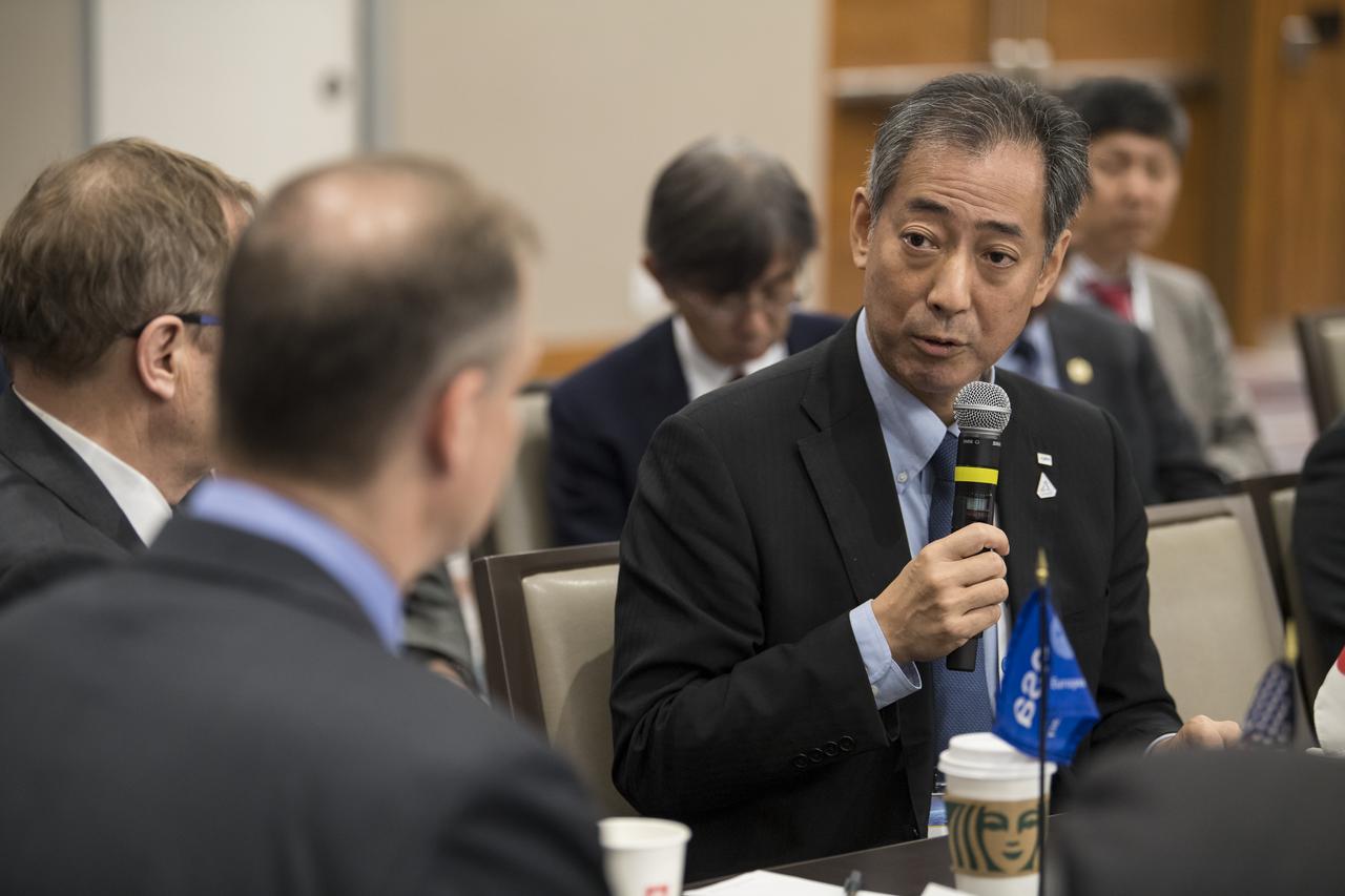 Japan Aerospace and Exploration Agency (JAXA) President, Dr. Hiroshi Yamakawa, speaks to NASA Administrator Jim Bridenstine during a multilateral meeting of the heads of space agencies at the 70th International Astronautical Congress, Tuesday, Oct. 22, 2019 in Washington. Photo Credit: (NASA/Aubrey Gemignani)