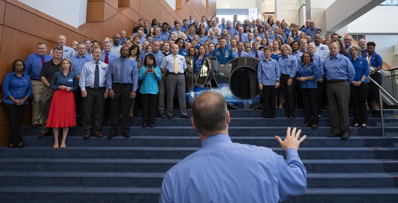 NASA Administrator Jim Bridenstine speaks to agency employees as they gather for a group picture at the 70th International Astronautical Congress, Wednesday, Oct. 23, 2019 at the Walter E. Washington Convention Center in Washington. Photo Credit: (NASA/Joel Kowsky)