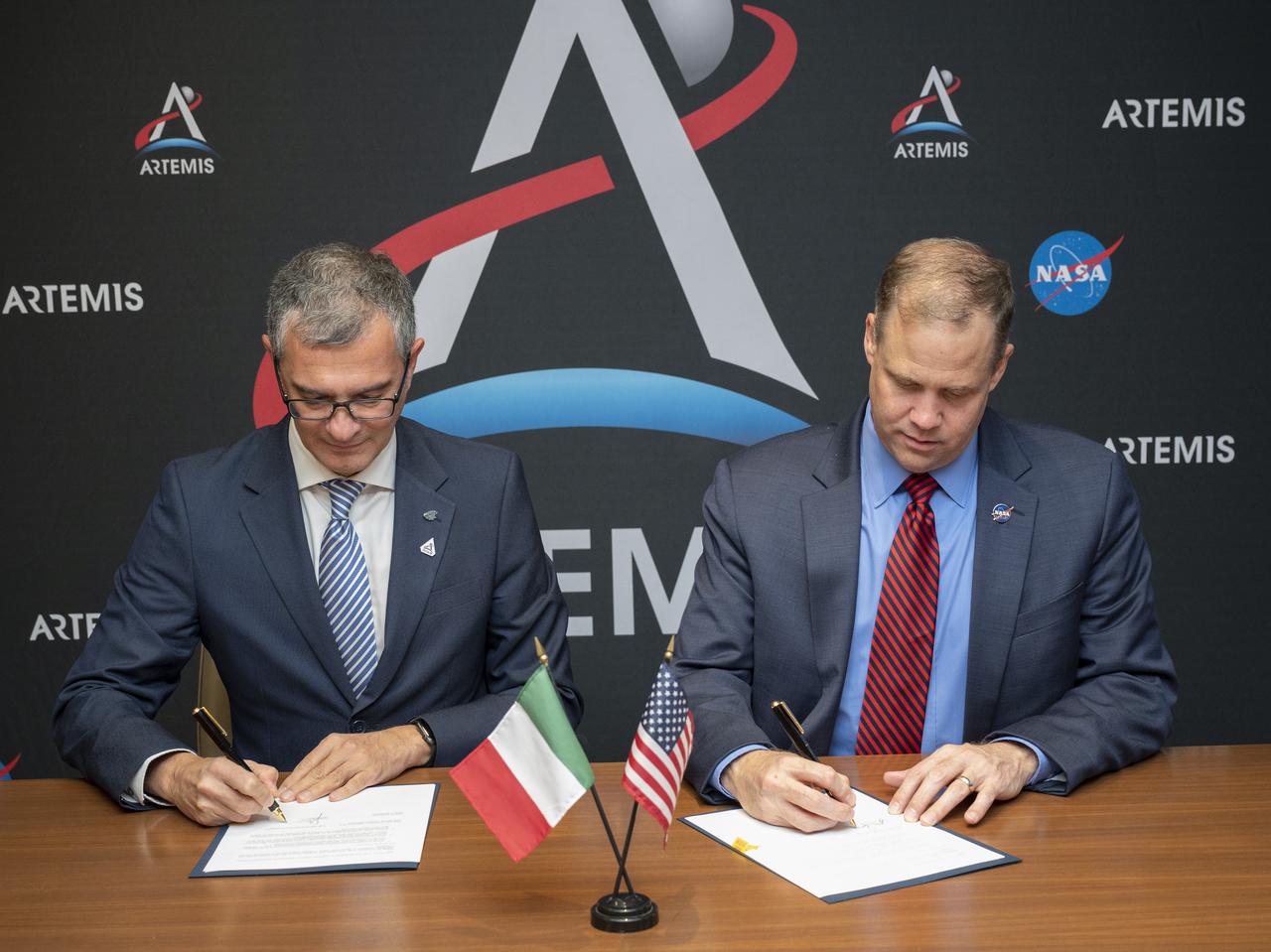 Giorgio Saccoccia Head of the Italian Space Agency (ASI), left, and NASA Administrator Jim Bridenstine sign a joint statement acknowledging the strong ongoing cooperation between the agencies, and identifying areas of potential future cooperation on and around the Moon as part of NASA’s Artemis program at the 70th International Astronautical Congress, Wednesday, Oct. 23, 2019 in Washington. Photo Credit: (NASA/Joel Kowsky)