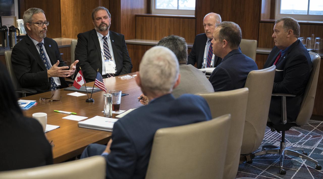 NASA Administrator Jim Bridenstine, NASA Deputy Administrator Jim Morhard, and Ken Bowersox, acting Associate Administrator for NASA's Human Exploration and Operations Mission Directorate, meet with Sylvain Laporte, President of the Canadian Space Agency, at the 70th International Astronautical Congress, Wednesday, Oct. 23, 2019 in Washington. Photo Credit: (NASA/Joel Kowsky)