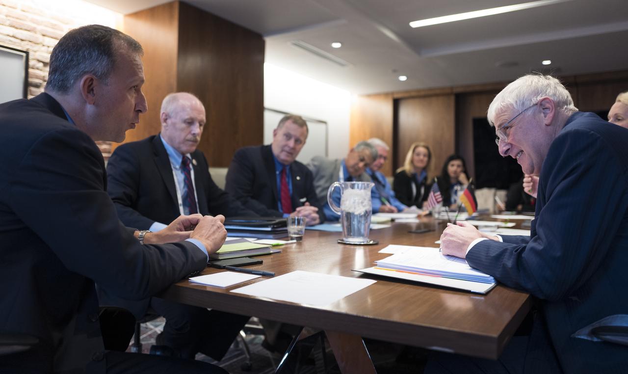 Thomas Zurbuchen, Associate Administrator of NASA's Science Mission Directorate, left, speaks with Hansjörg Dittus, Executive Board Member for Space Research and Technology at the German Aerospace Center (DLR) during a meeting at the 70th International Astronautical Congress, Wednesday, Oct. 23, 2019 in Washington. Photo Credit: (NASA/Joel Kowsky)