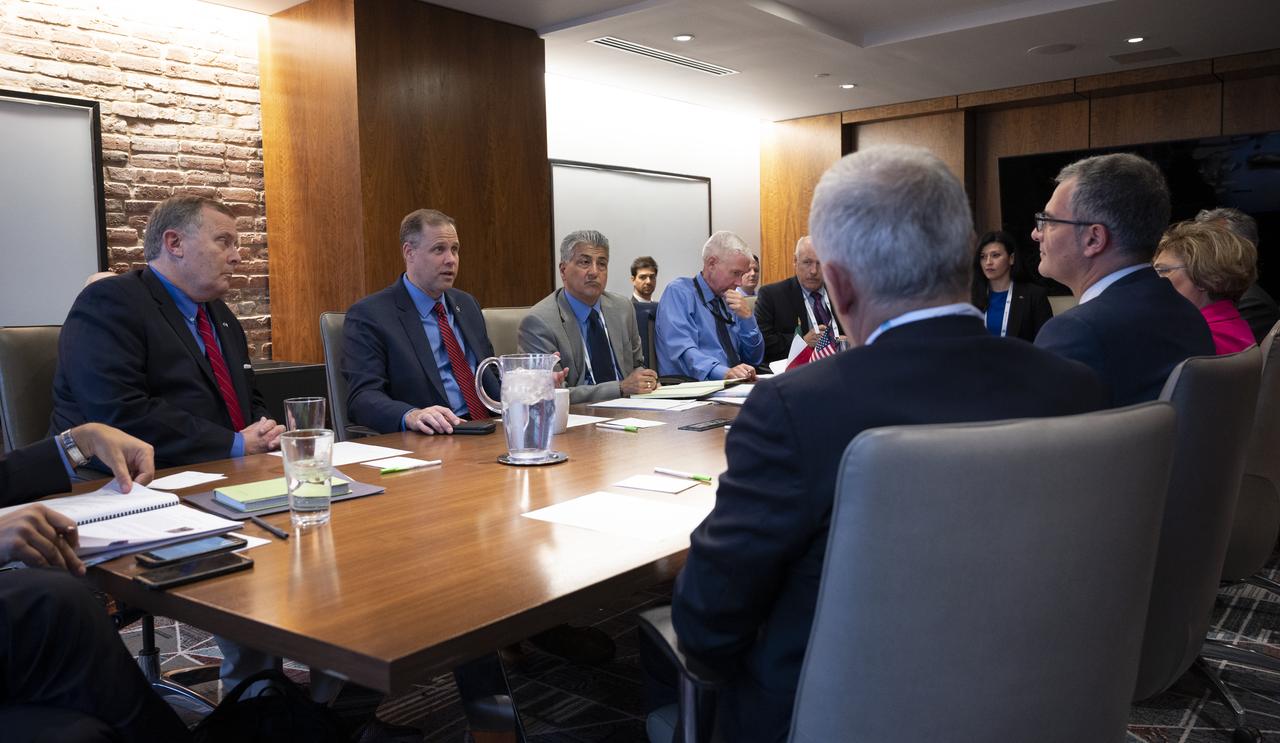 NASA Deputy Administrator Jim Morhard, left, and NASA Administrator Jim Bridenstine meet with Giorgio Saccoccia Head of the Italian Space Agency (ASI), before the signing of a joint statement at the 70th International Astronautical Congress, Wednesday, Oct. 23, 2019 in Washington. Photo Credit: (NASA/Joel Kowsky)