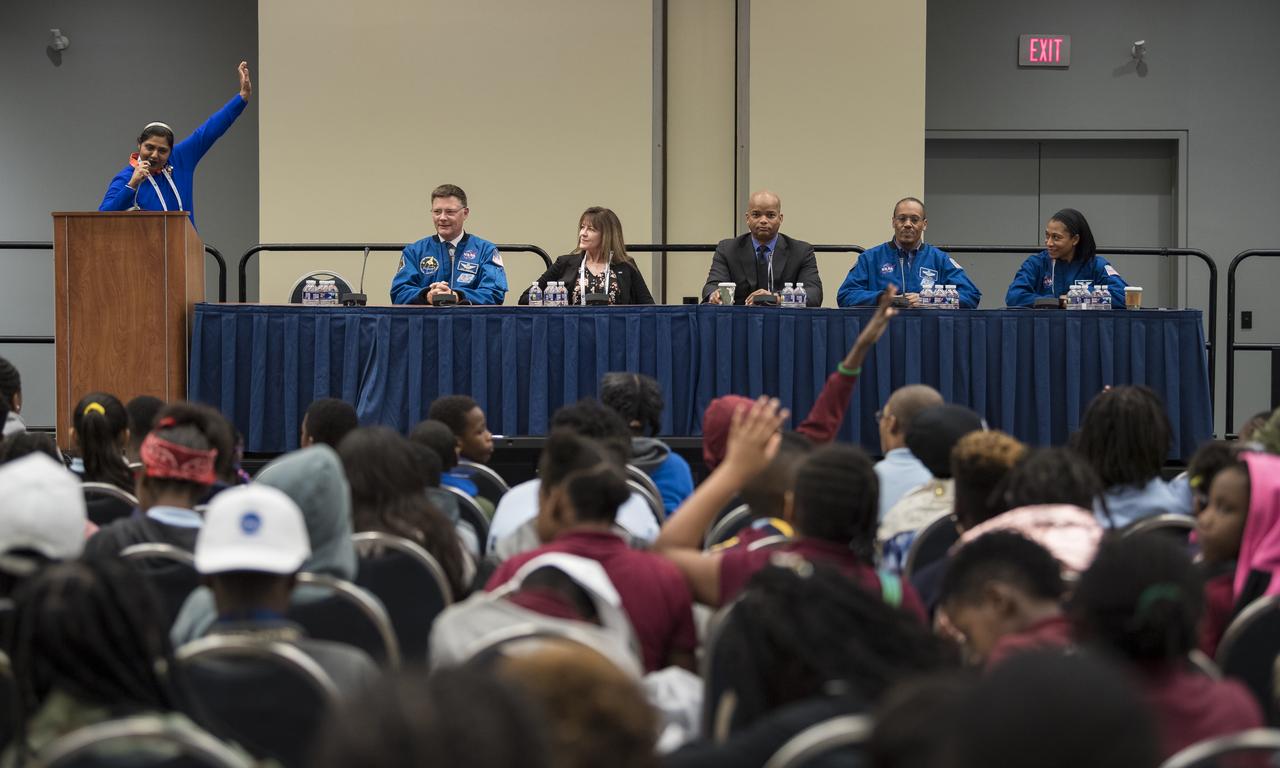 NASA astronauts Doug Wheelock, left, Alvin Drew, second from right, Jeanette Epps, right, and former astronauts Janet Kavandi, second from left, and Bob Curbeam, center, spoke about their time in space at a STEM day session with students during the 70th International Astronautical Congress, Wednesday, Oct. 23, 2019 at the Walter E. Washington Convention Center in Washington. Photo credit: (NASA/Aubrey Gemignani)