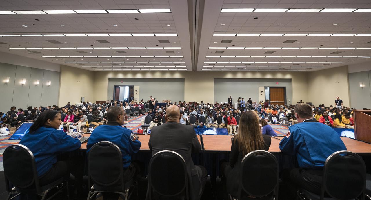 NASA astronauts Jeanette Epps, left, Alvin Drew, second from left, Doug Wheelock, right, and former astronauts Bob Curbeam, center, and Janet Kavandi, second from right, spoke about their time in space at a STEM day session with students during the 70th International Astronautical Congress, Wednesday, Oct. 23, 2019 at the Walter E. Washington Convention Center in Washington. Photo credit: (NASA/Aubrey Gemignani)