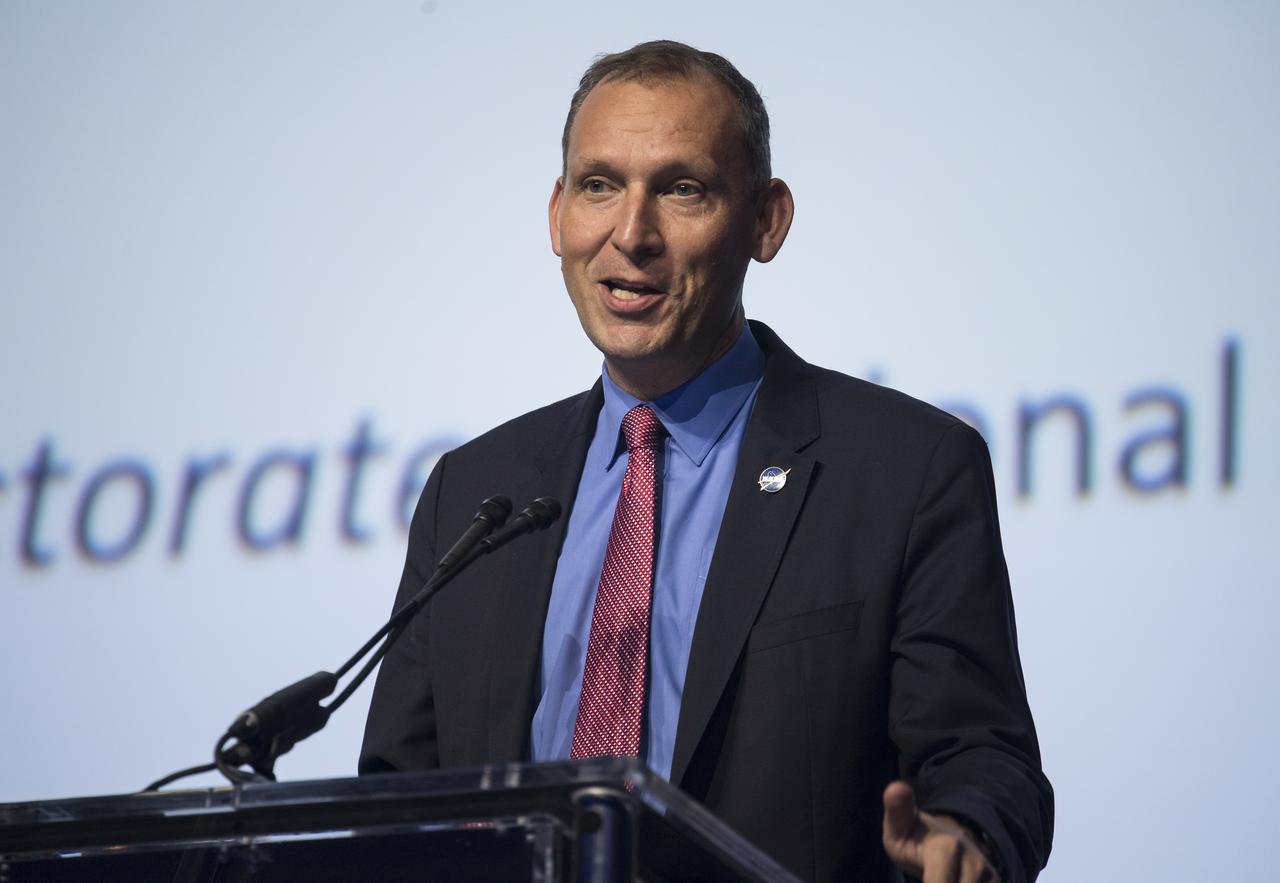 NASA Associate Administrator, Science Mission Directorate, Thomas Zurbuchen, introduces Nicola Fox, director of the Heliophysics division for the Science Mission Directorate, to give a presentation titled, “The Challenge of Exploring Our Sun - the 60-Year Odyssey to Parker Solar Probe,” during the 70th International Astronautical Congress, Wednesday, Oct. 23, 2019, at the Walter E. Washington Convention Center in Washington. Photo credit: (NASA/Aubrey Gemignani)