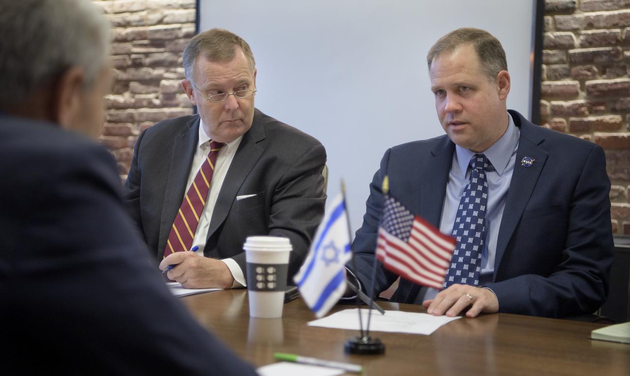 NASA Deputy Administrator Jim orchard, left, and NASA Administrator Jim Bridenstine meet with Avi Blasberger, Director of the Israel Space Agency (ISA) during the 70th International Astronautical Congress, Thursday, Oct. 24, 2019, in Washington. Photo Credit: (NASA/Bill Ingalls)