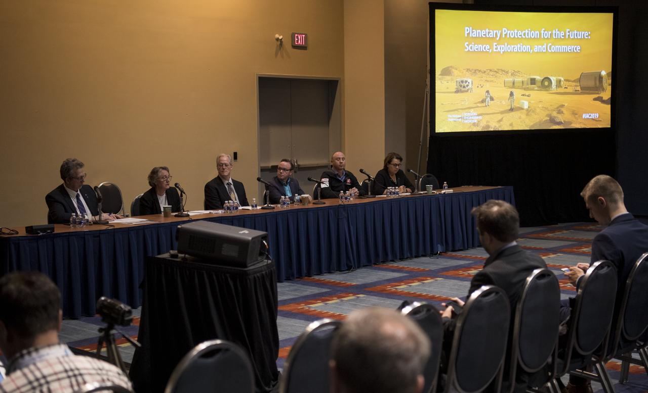 NASA Chief Scientist Jim Green, left, Lisa Pratt, NASA's Planetary Protection Officer, Michael Meyer, Lead Scientist for NASA's Mars Exploration Program, Dan Hendrickson, Vice President of Business Development at Astrobotic Technology, Kyle Acierno, Vice President of Global Sales and Strategy at ispace, and Simonetta Di Pippo, Director of the United Nations Office for Outer Space Affairs, right, are seen during a special session titled “Planetary Protection for the Future: Science, Exploration, and Commerce” at the 70th International Astronautical Congress, Thursday, Oct. 24, 2019, at the Walter E. Washington Convention Center in Washington. Photo Credit: (NASA/Joel Kowsky)