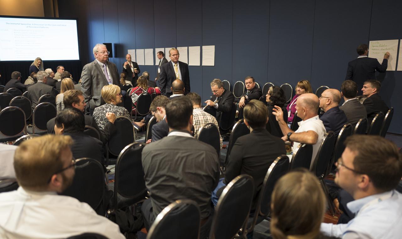 Audience members participate in a special session titled ”The Immortal Spaceship: A Discussion on the Use Cases and Value of Persistent Platforms” at the 70th International Astronautical Congress, Thursday, Oct. 24, 2019, at the Walter E. Washington Convention Center in Washington. Photo Credit: (NASA/Joel Kowsky)