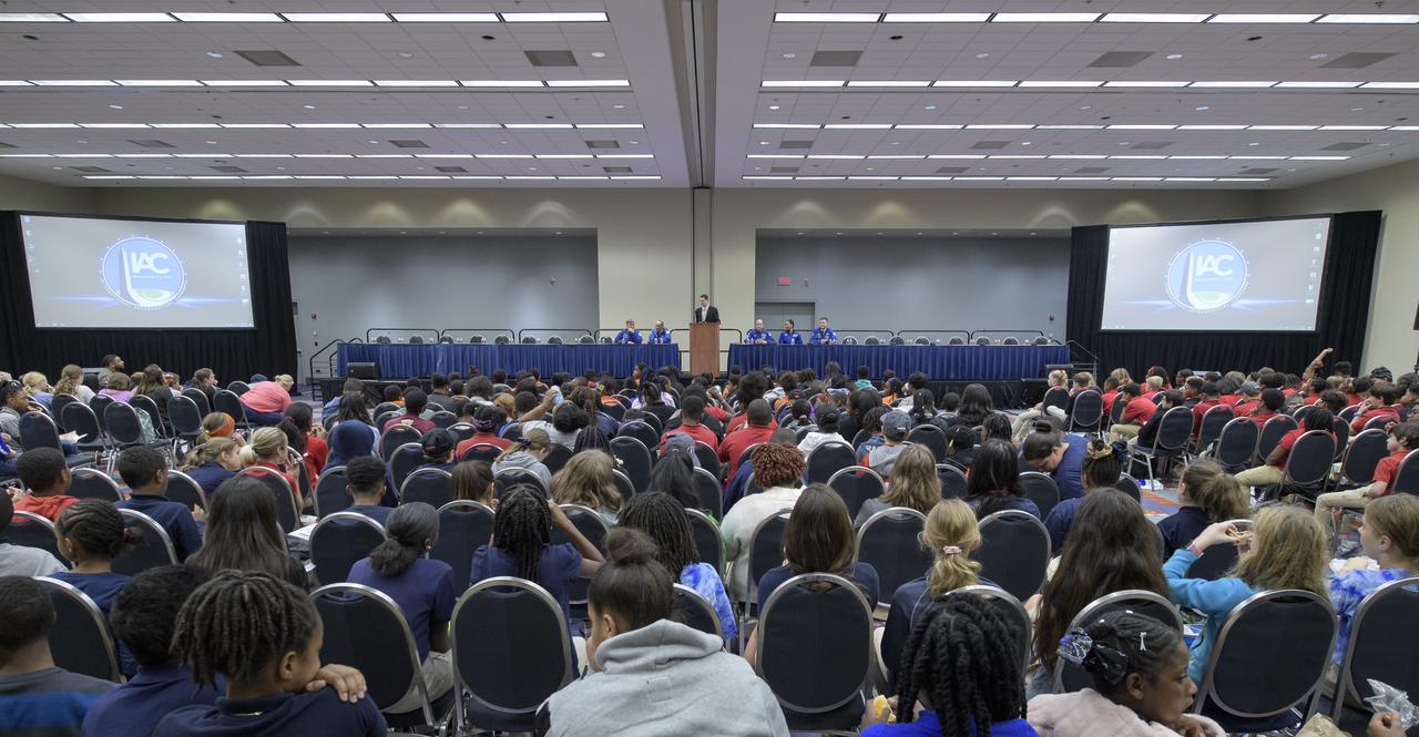 Former NASA astronaut Frank Culbertson, left, NASA astronaut Alvin Drew, former NASA astronaut Garrett Reisman, NASA astronauts Jeanette Epps, and Doug Wheelock, right, talk about their time in space at a STEM day session with students during the 70th International Astronautical Congress, Thursday, Oct. 24, 2019, in Washington. Photo Credit: (NASA/Bill Ingalls)