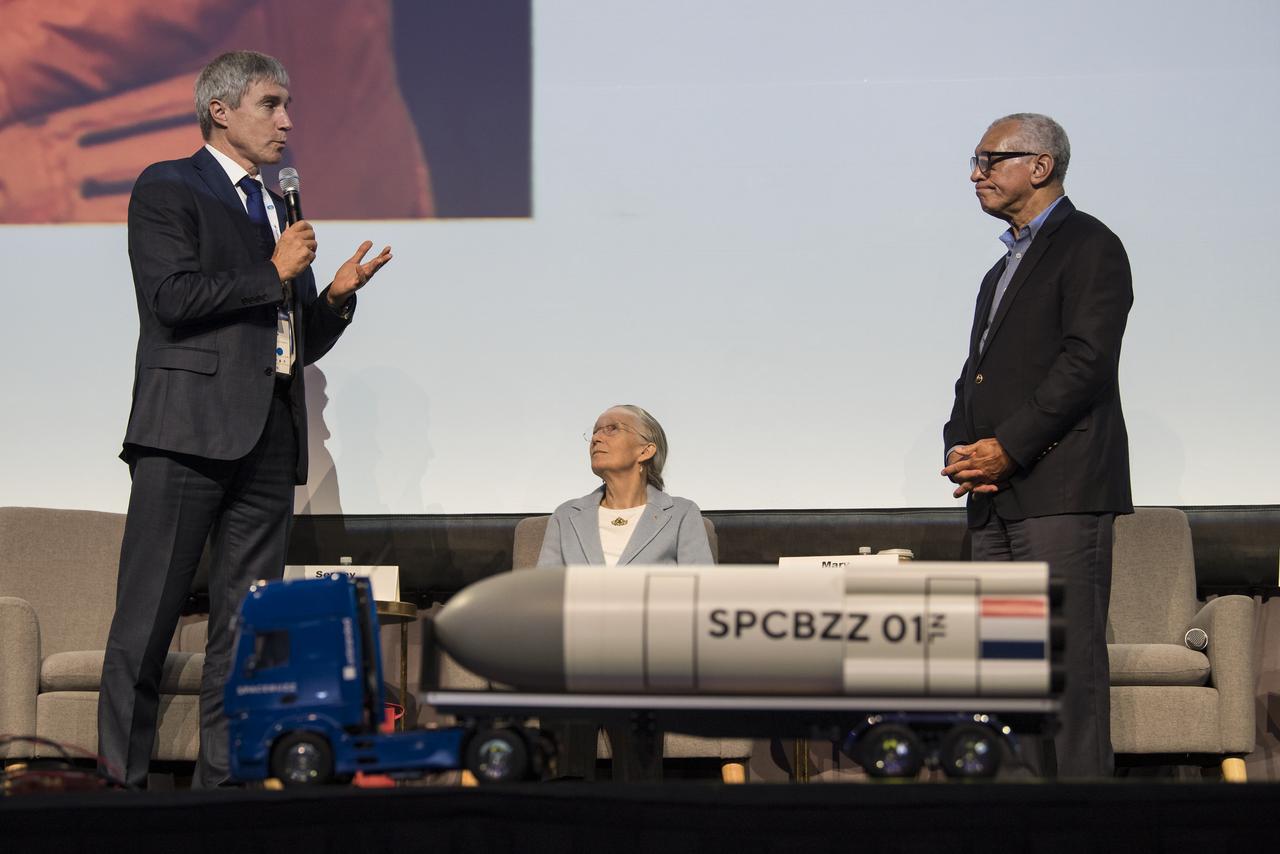 Roscosmos cosmonaut and executive director for piloted spaceflights, Sergey Krikalev speaks to former NASA Administrator and astronaut, Charlie Bolden during an astronaut and cosmonaut panel discussion at the 70th International Astronautical Congress, Friday, Oct. 25, 2019 at the Walter E. Washington Convention Center in Washington. Photo credit: (NASA/Aubrey Gemignani)