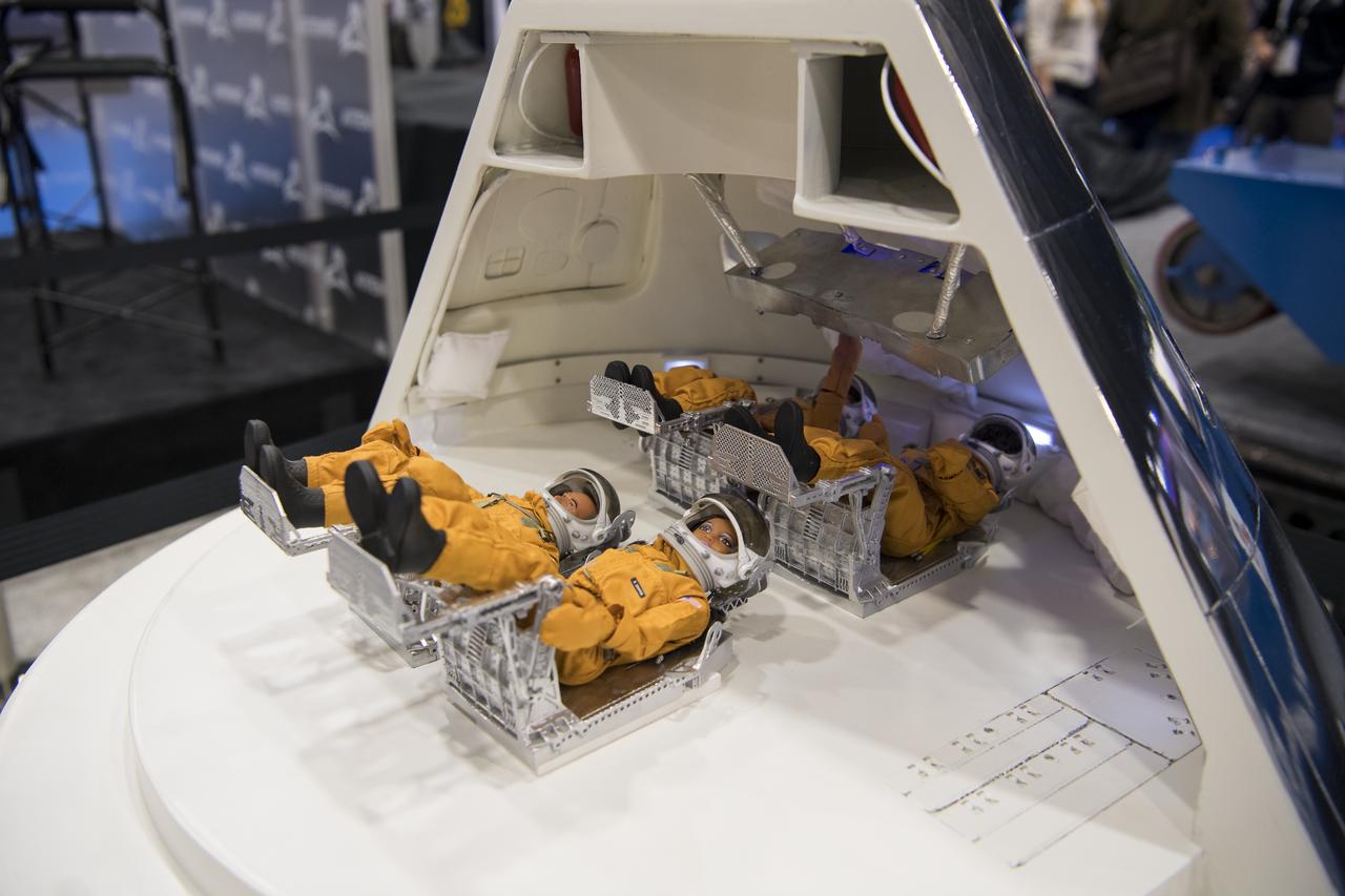 A model of the inside of Orion is seen at the NASA exhibit during the 70th International Astronautical Congress, Friday, Oct. 25, 2019, at the Walter E. Washington Convention Center in Washington. Photo credit: (NASA/Aubrey Gemignani)