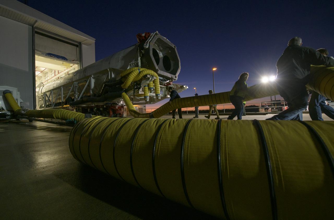 A Northrop Grumman Antares rocket is seen as it is rolled out of the Horizontal Integration Facility to launch Pad-0A, Tuesday, Oct. 29, 2019, at NASA's Wallops Flight Facility in Virginia. Northrop Grumman’s 12th contracted cargo resupply mission with NASA to the International Space Station will deliver about 8,200 pounds of science and research, crew supplies and vehicle hardware to the orbital laboratory and its crew. Launch is scheduled for 9:59 a.m. EDT Saturday, Nov. 2.  Photo Credit: (NASA/Bill Ingalls)