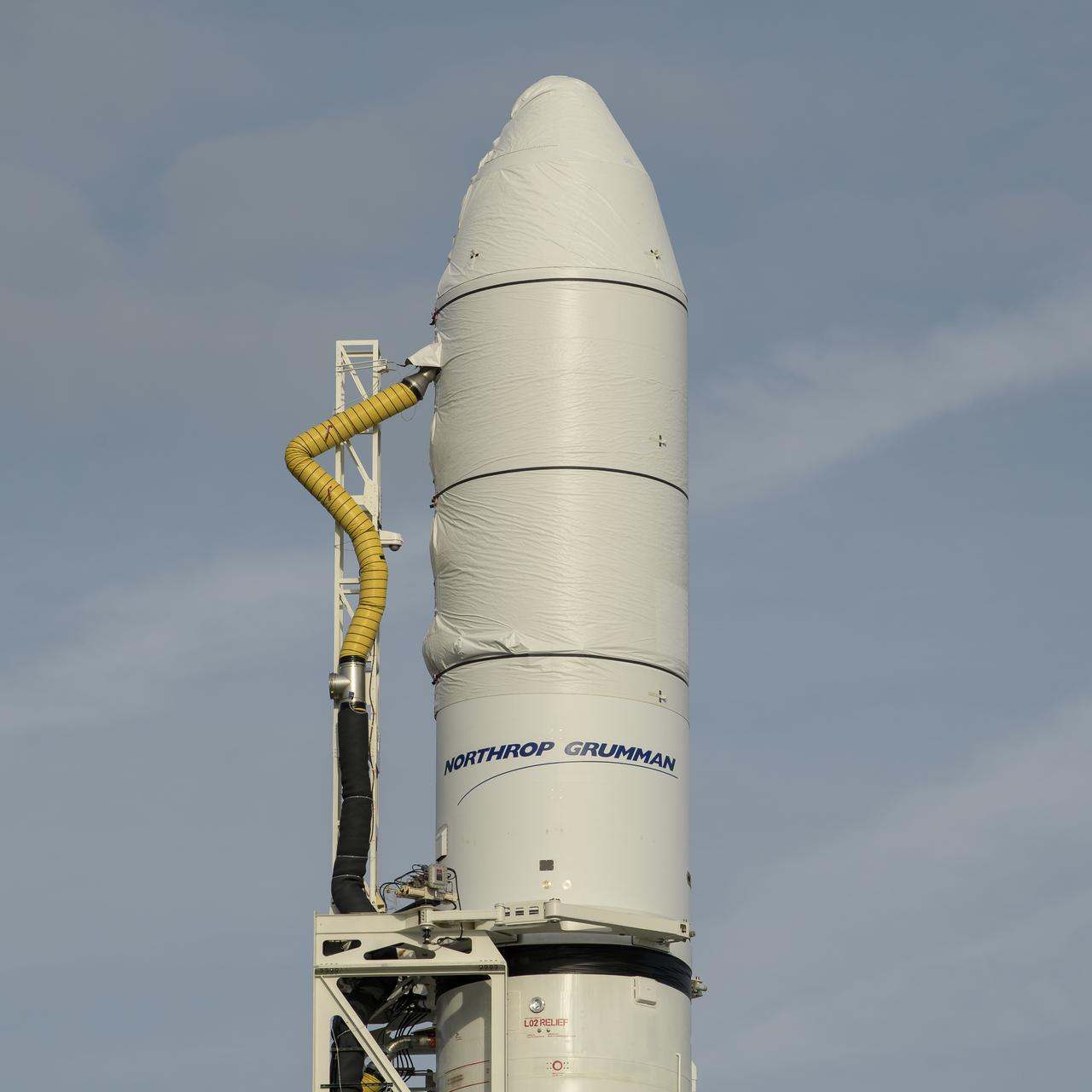 The Northrop Grumman Antares rocket is seen a few hours after arriving at launch Pad-0A, Tuesday, Oct. 29, 2019, at NASA's Wallops Flight Facility in Virginia. Northrop Grumman’s 12th contracted cargo resupply mission with NASA to the International Space Station will deliver about 8,200 pounds of science and research, crew supplies and vehicle hardware to the orbital laboratory and its crew. Launch is scheduled for 9:59 a.m. EDT Saturday, Nov. 2.  Photo Credit: (NASA/Bill Ingalls)
