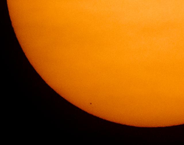 The planet Mercury is seen in silhouette, low center, as it transits across the face of the Sun Monday, Nov. 11, 2019, from Washington.  Mercury’s last transit was in 2016.  The next won’t happen again until 2032. Photo Credit: (NASA/Bill Ingalls)